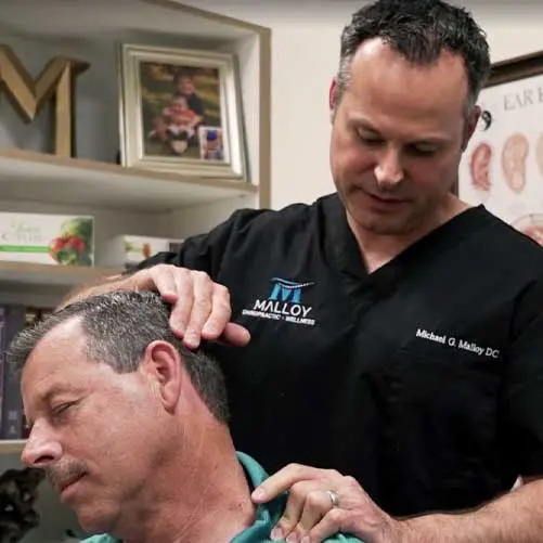 Chiropractor Fort Worth Michael Malloy with Patient