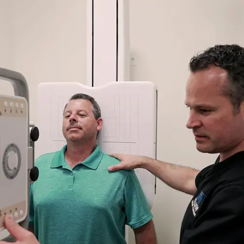 Chiropractor Fort Worth TX Michael Malloy with Patient Chiropractor Fort Worth TX Michael Malloy with Patient